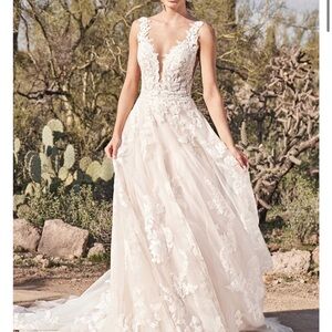 Brand new and unaltered Lillian West (66163) Wedding Dress!